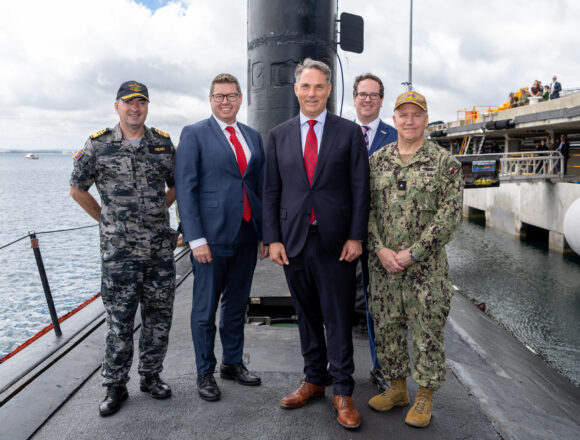 Defence Minister Richard Marles (centre) and Defence Industry Minister Pat Conroy (second left) on USS Asheville at HMAS Stirling in WA. Photo US Indo-Pacific Command/Flickr
