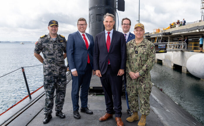 Defence Minister Richard Marles (centre) and Defence Industry Minister Pat Conroy (second left) on USS Asheville at HMAS Stirling in WA. Photo US Indo-Pacific Command/Flickr